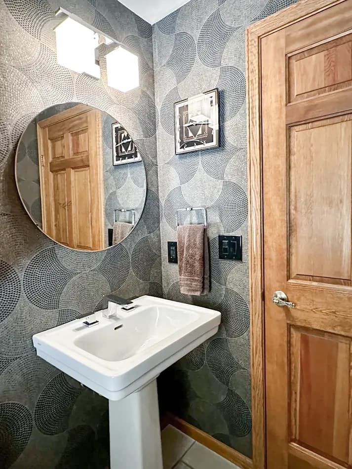 Wallpapering in bathroom