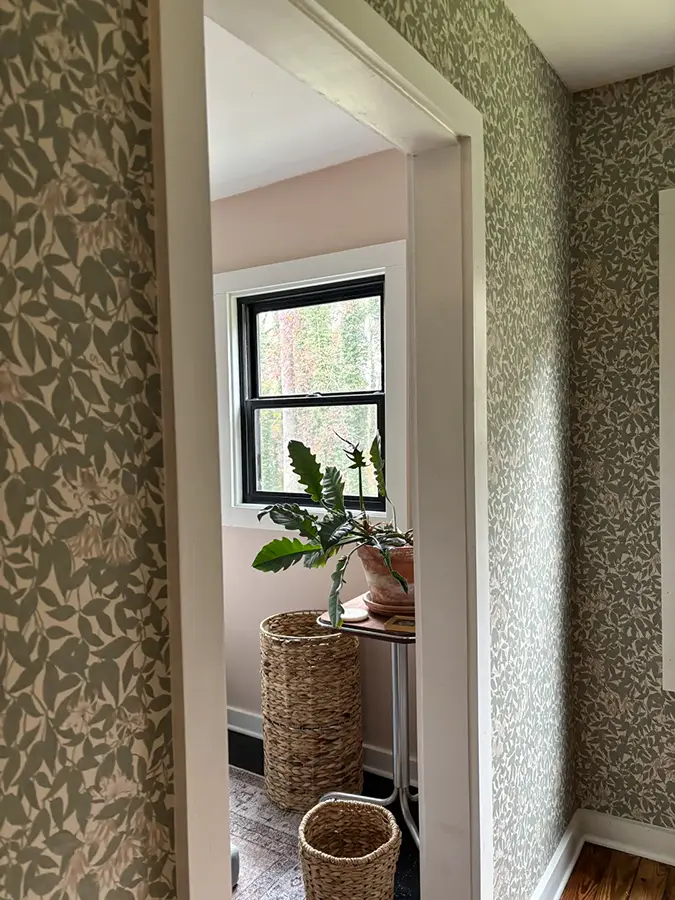 Wallpapering in hallway
