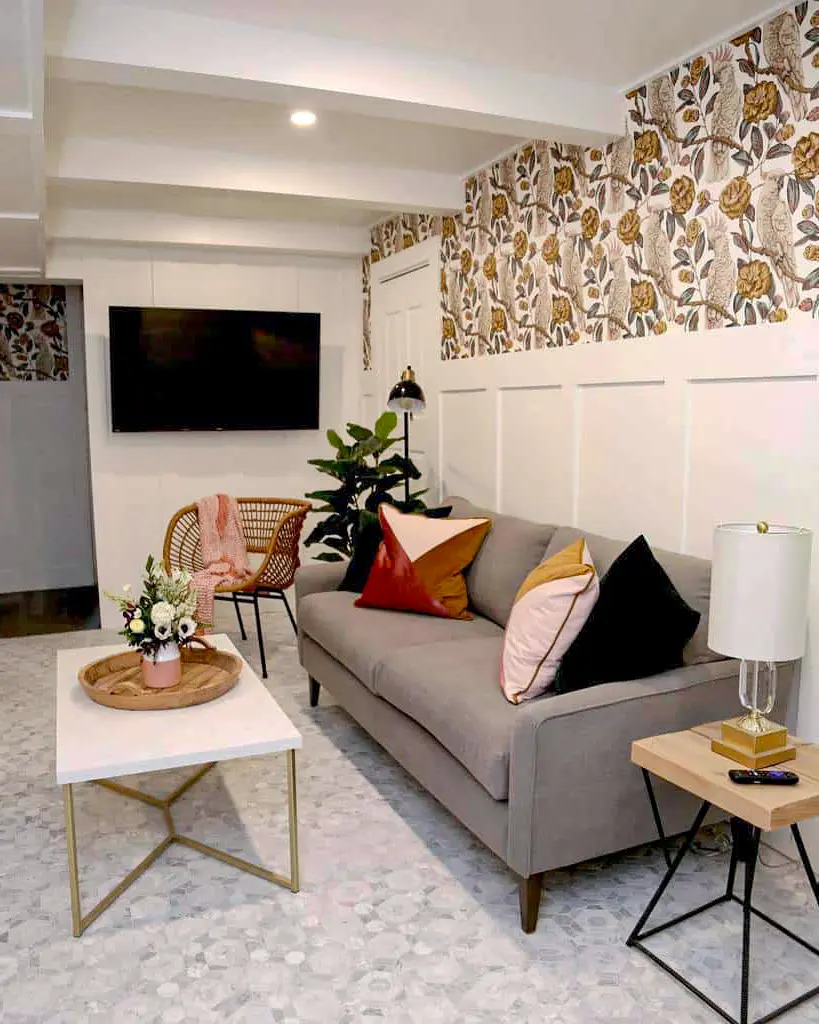 Modern basement entertainment room with feature wallpaper