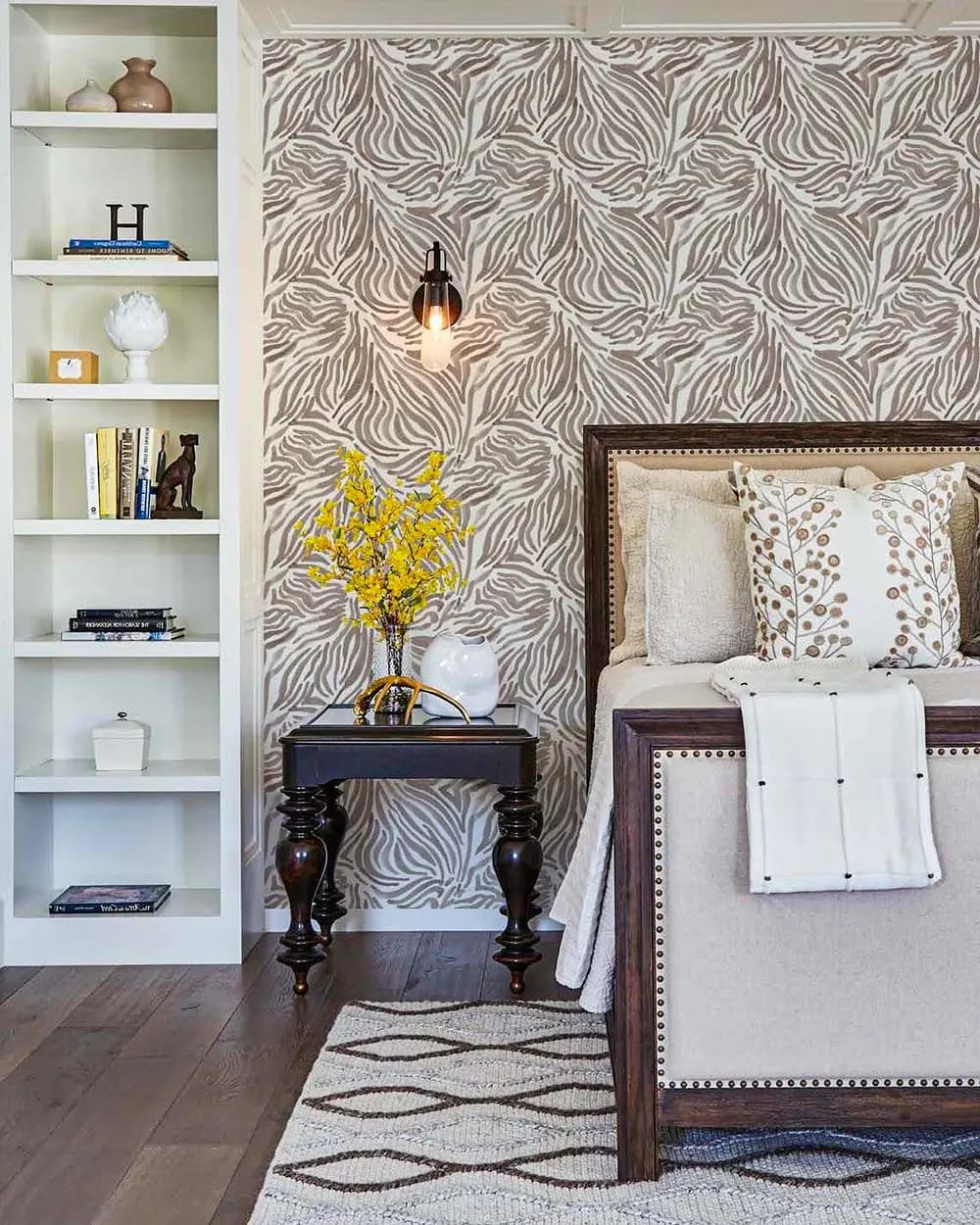 Designer wallpaper installed in spacious master bedroom with natural lighting