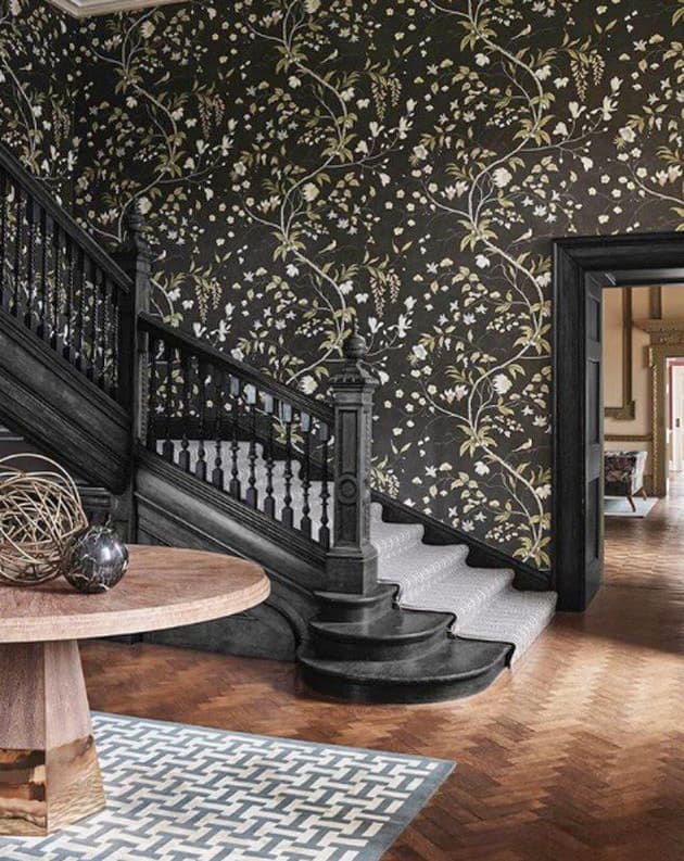 Patterned wallpaper installed along staircase wall